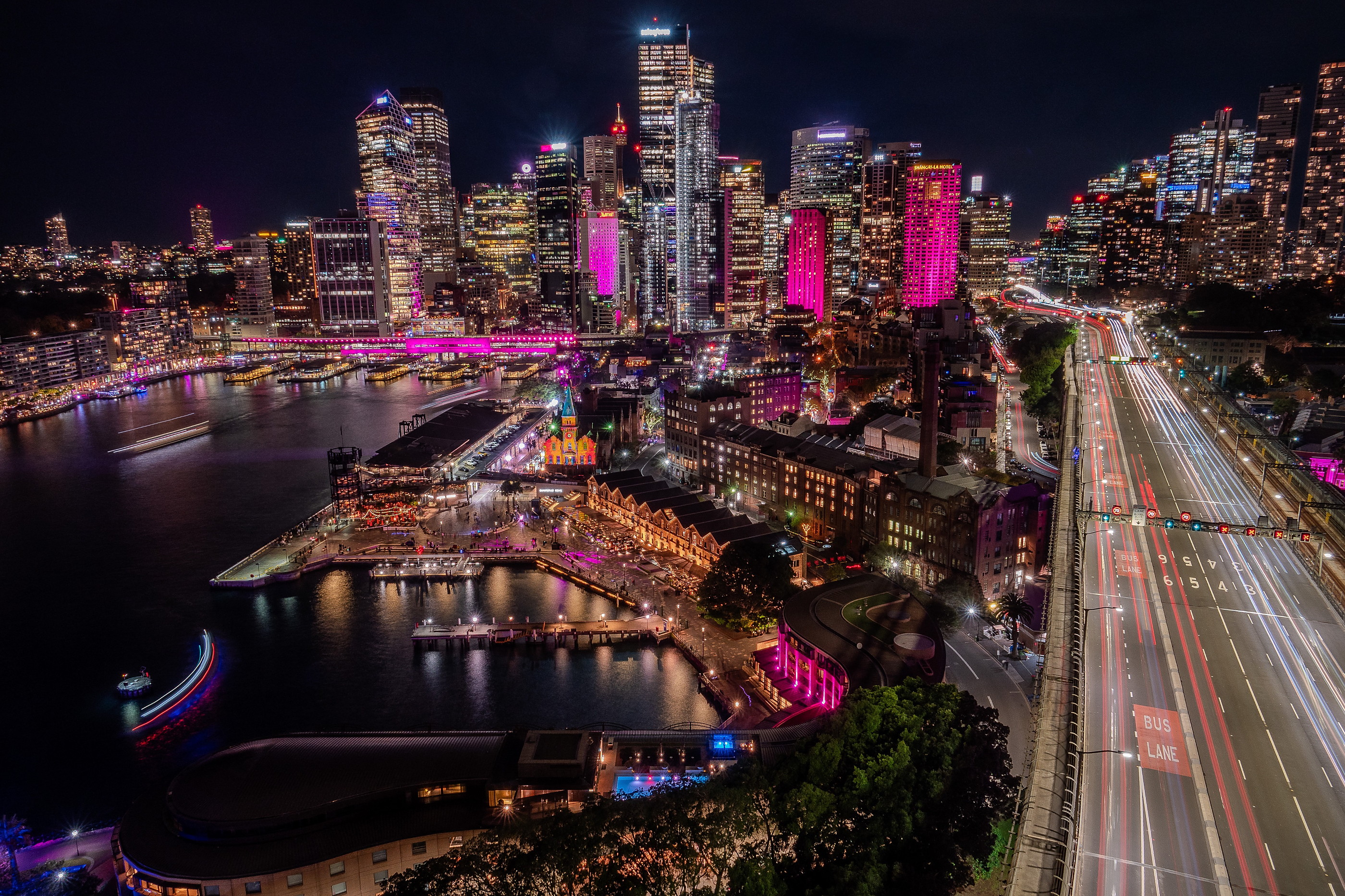 Circular Quay and The Rocks from above during Vivid, with traffic light trails