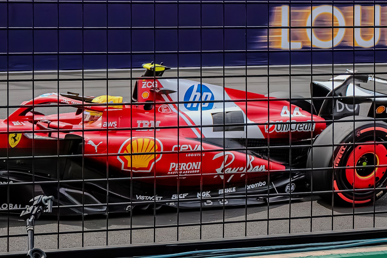Formula 1 car at speed behind the catch fence, Albert Park